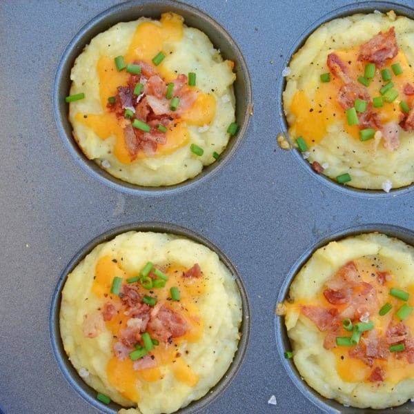 Loaded Mashed Potato Cups are the best way to use leftover mashed potatoes. Mixed with cheese, eggs and a few other ingredients, you load them into a muffin tin and poof, you've got finger food mashed potatoes! #mashedpotatoes #mashedpotatocups www.savoryexperiments.com