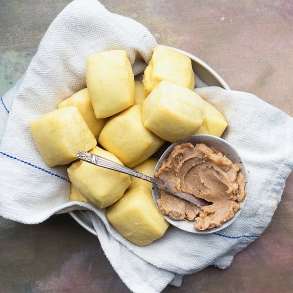 basket of yeast rolls with honey cinnamon butter