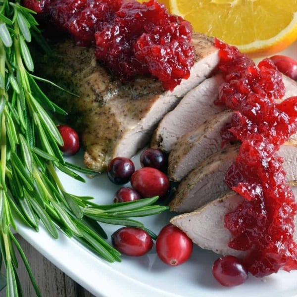 pork tenderloin sliced with cranberry sauce