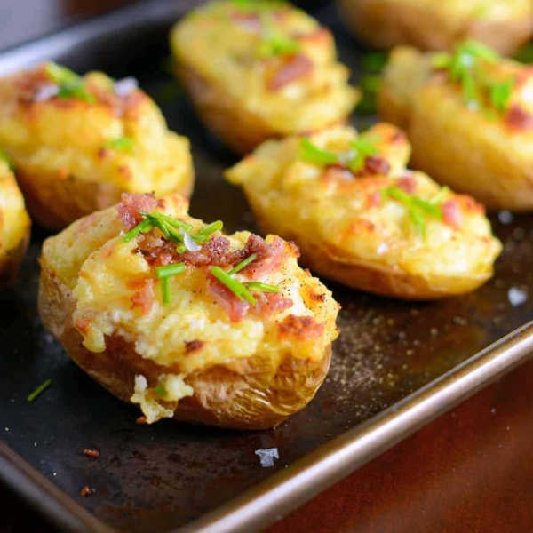 These cheesy twice baked potatoes are the BEST! My whole family gobbles them up, so I make double. The secret ingredient really makes these POP and stand out from the rest.