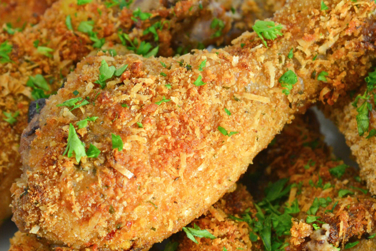 close up of a breaded chicken drumstick