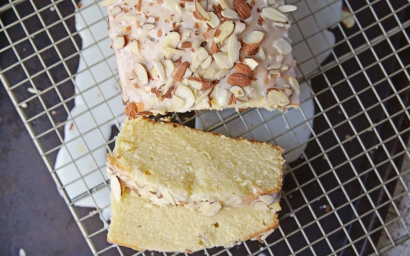 This Almond Pound Cake recipe is easy, moist and as dense as a pound cake should be. Topped with an almond pound cake glaze, it's the perfect dessert! #almondpoundcake #poundcakerecipe www.savoryexperiments.com