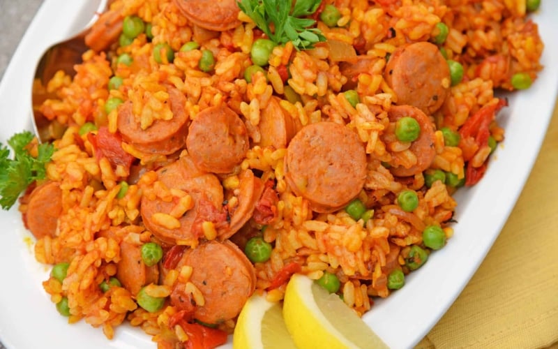 Instant Pot Chicken Paella is based off the traditional Spanish dish. Flavorful & ready in just minutes, this will be your go-to chicken and rice recipe. #chickenpaella #instantpotchickenrecipes #chickenandricerecipe www.savoryexperiments.com