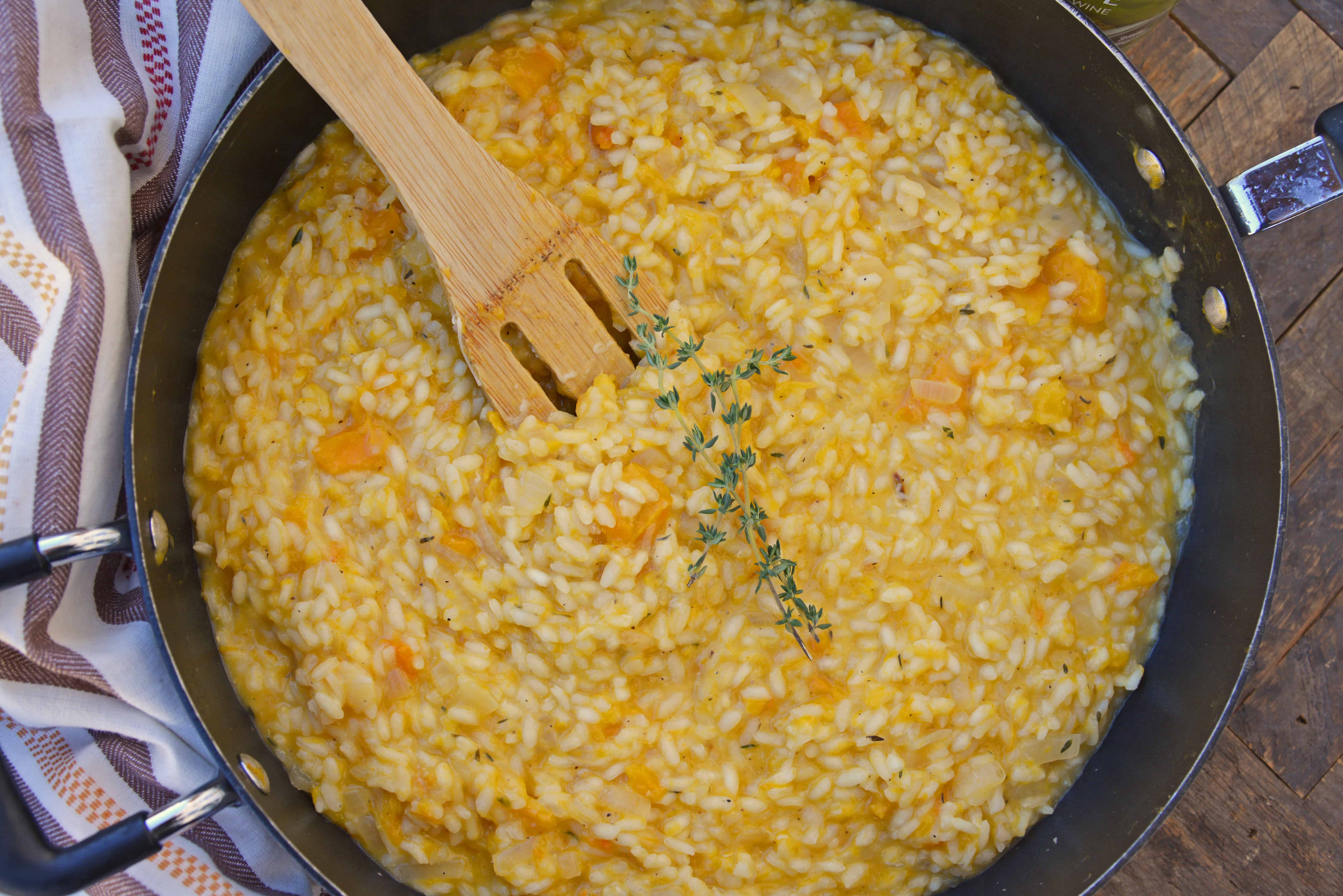 Butternut Squash Risotto is an easy side dish or entrée made with Arborio rice, crisp white cooking wine, sweet roasted butternut squash and fresh thyme. #risottorecipes #butternutsquash www.savoryexperiments.com 