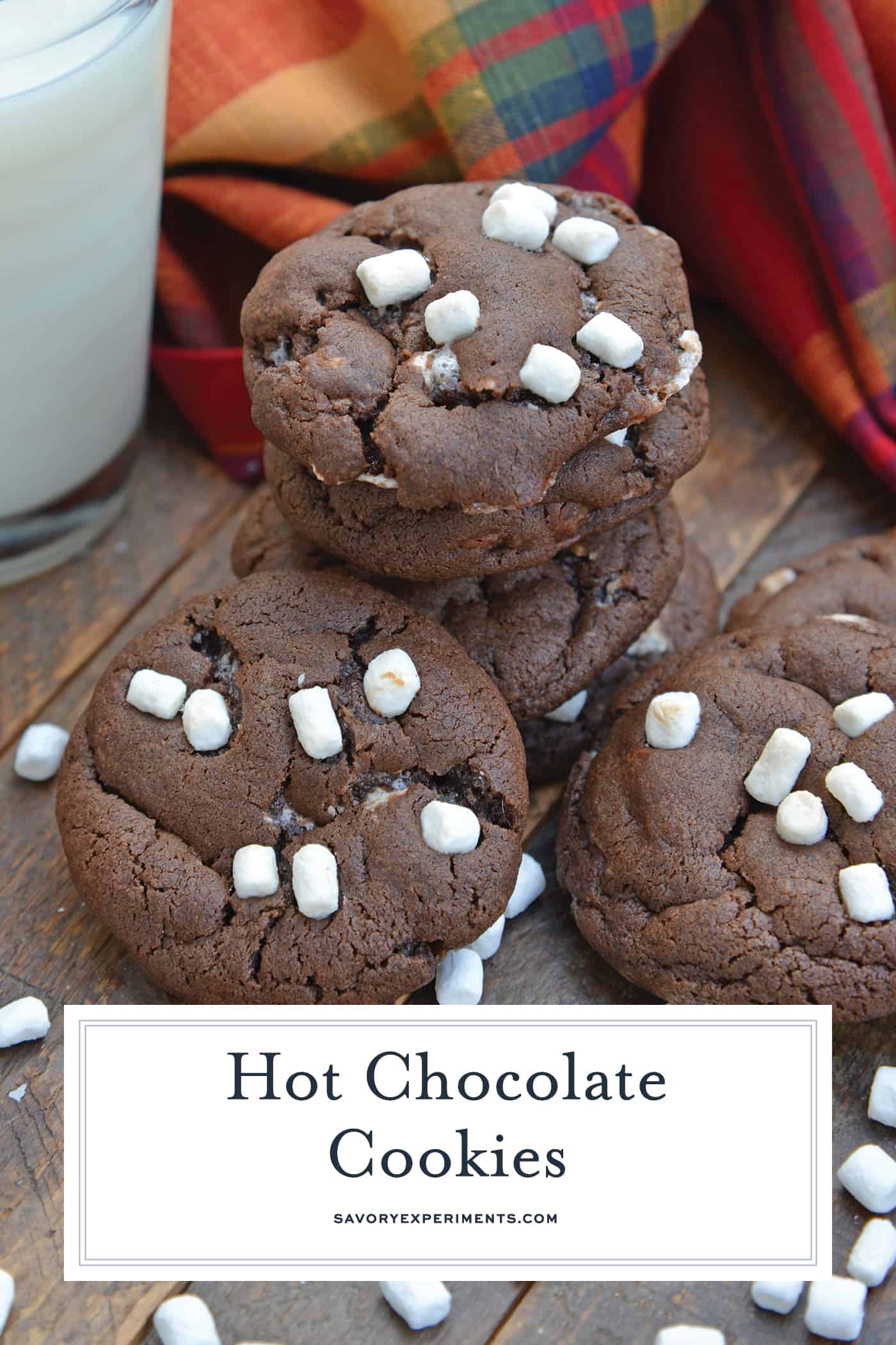 Hot Chocolate Cookies are must-make Christmas cookies! A favorite chocolate sugar cookie recipe with marshmallows, you'll never be able to eat just one! #hotchocolatecookies #chocolatesugarcookiesrecipe #christmascookies www.savoryexperiments.com