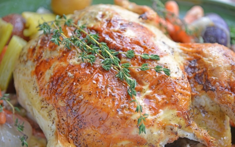 close up of roast chicken with thyme