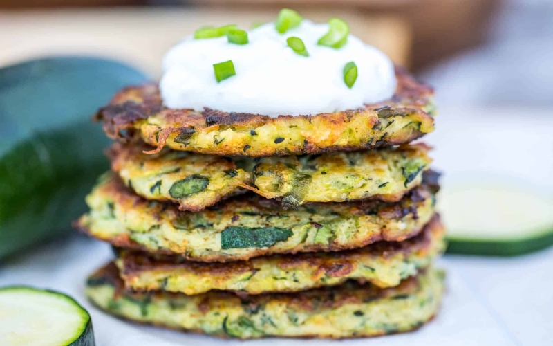 zucchini fritters with sour cream topping