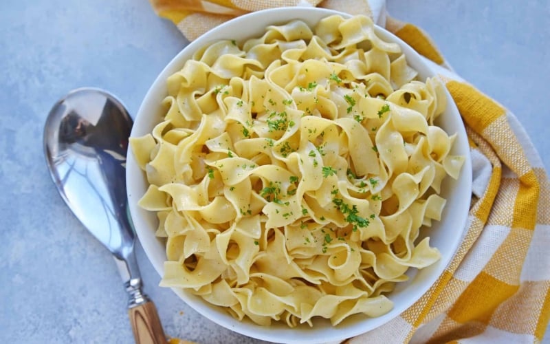 buttered noodles in a serving dish