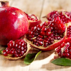 Pomegranate cut open with seeds coming out