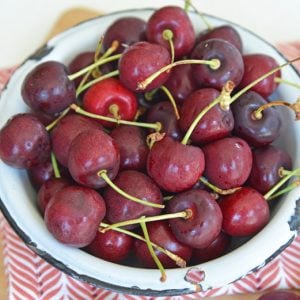 angled shot of bowl of fresh cherries