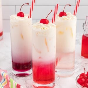 head on homemade cream soda with cherry garnish