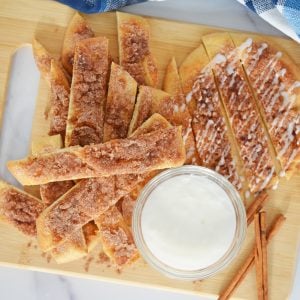 serving platter of cinna sticks with dipping sauce