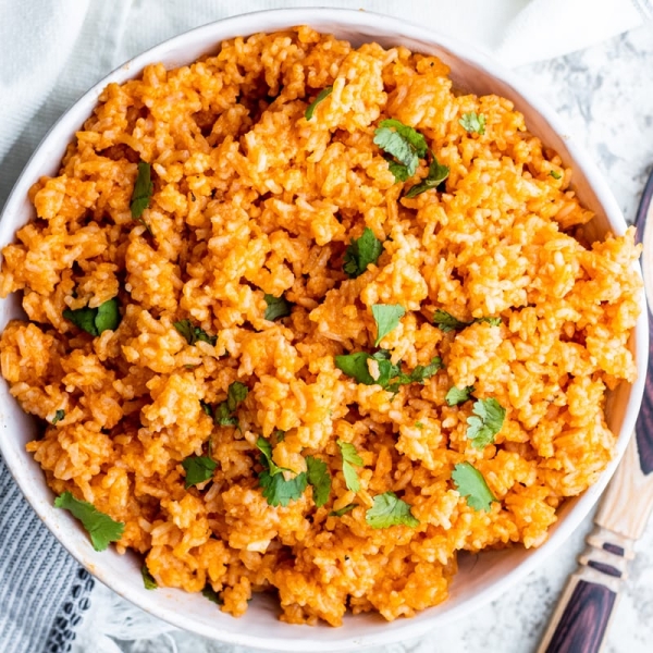 overhead of spanish rice in a white serving bowl