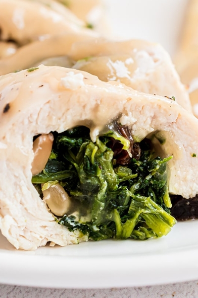 close up angled shot of spinach stuffed chicken