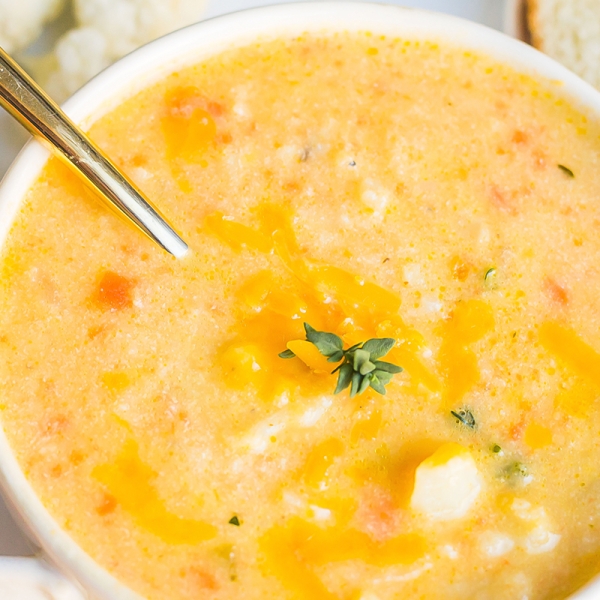 close up of cauliflower soup recipe with a spoon