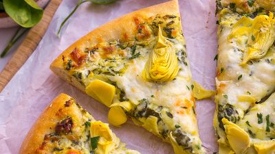 one slice of spinach artichoke pizza