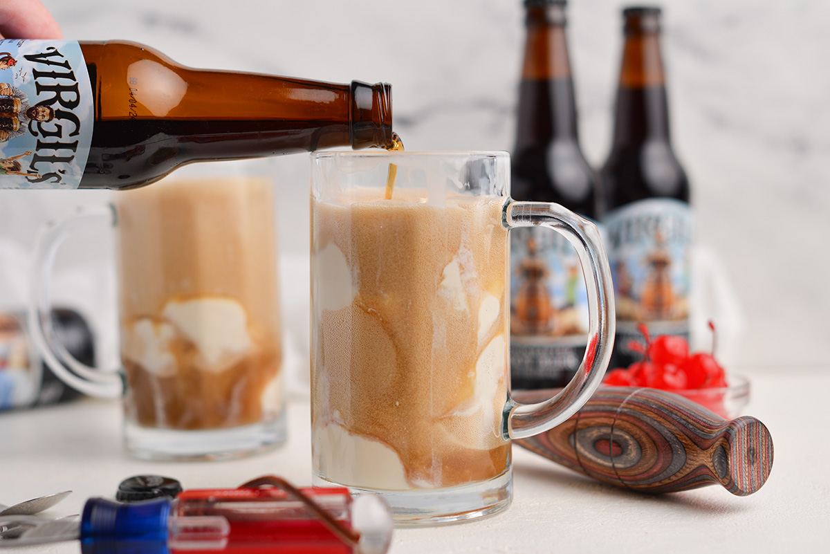 bottle of root beer pouring into an ice cream float 