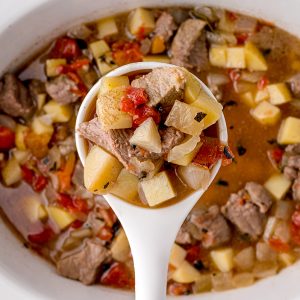 overhead shot of slow cooker beef stew in a ladle