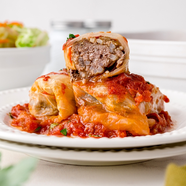 half a cabbage roll stacked on two cabbage rolls