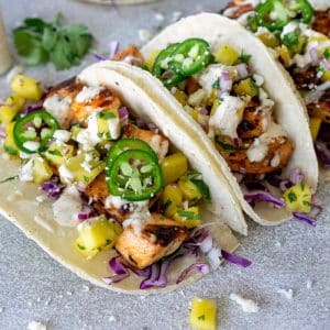 angled shot of three fish tacos