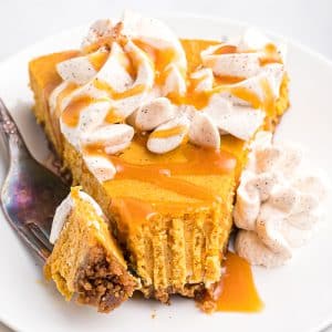 fork taking a bite of pumpkin cheesecake