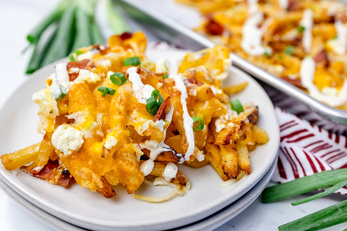 https://www.savoryexperiments.com/wp-content/uploads/2022/10/Ranch-Bacon-Cheese-Fries-5.jpg