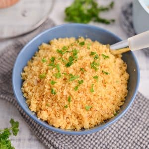 blue serving bowl of couscous