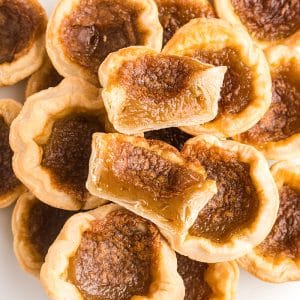 overhead shot of pile of butter tarts cut in half