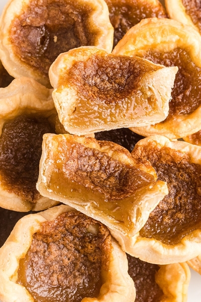 overhead shot of pile of butter tarts cut in half