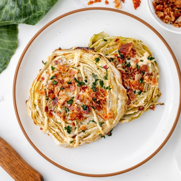 overhead shot of two cabbage steaks on plate