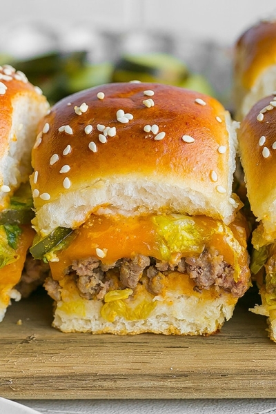 line of three big mac sliders on cutting board