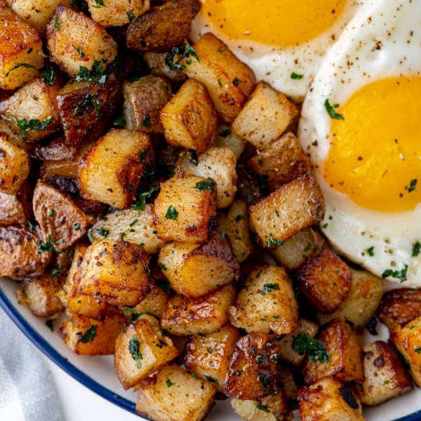 fried potatoes with fried eggs