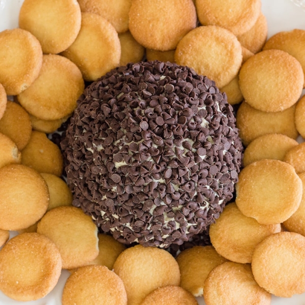 A close up of cookie dough cheese ball with nilla wafers