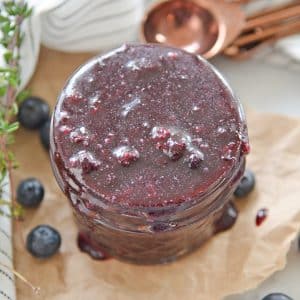 overhead of fruit sauce in a glass jar