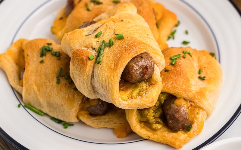 close up of a sausage link in crescent dough