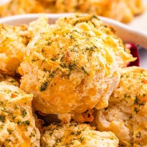 close up of basket of cheddar bay biscuits