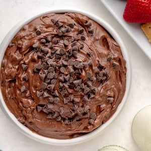 overhead bowl of brownie batter dip topped with mini chocolate chips