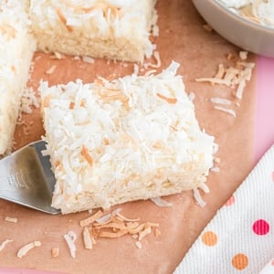 spatula holding one square of coconut bars