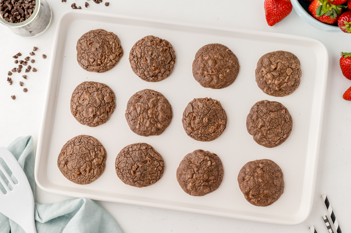 angled white baking sheet with brownie mix cookies