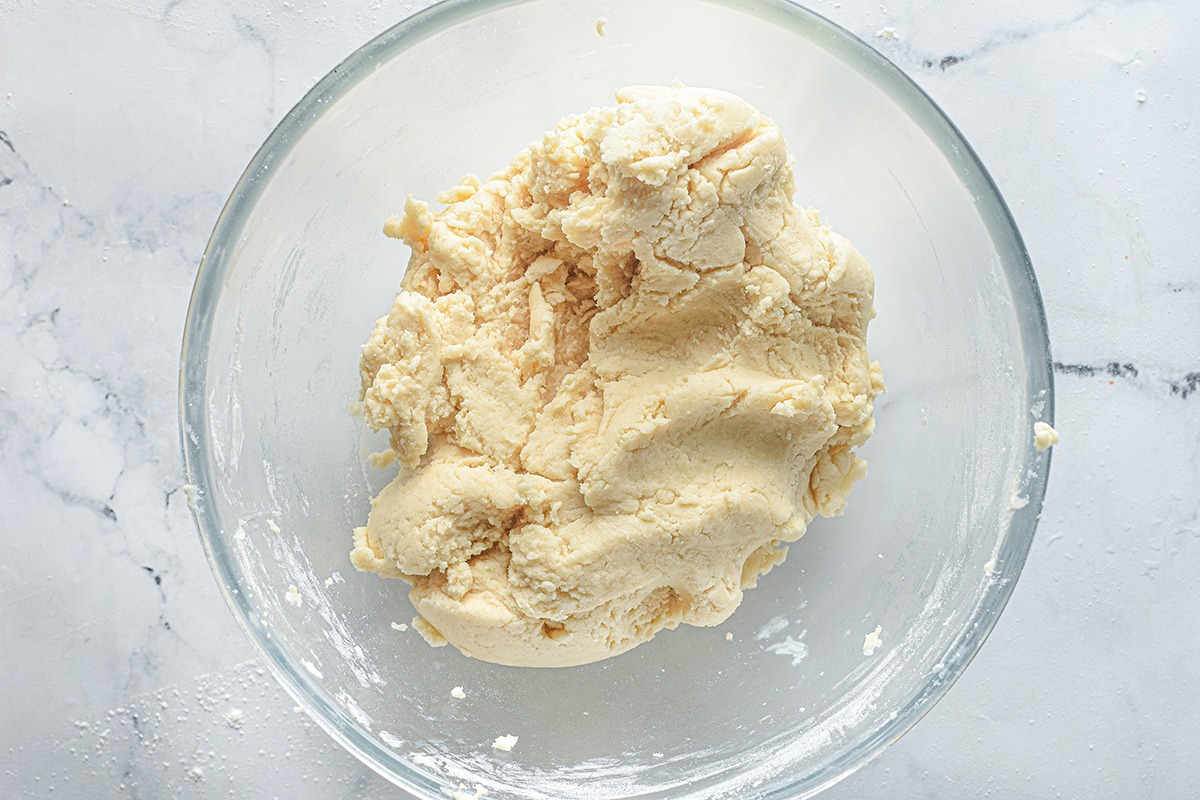 cookie dough in a glass mixing bowl