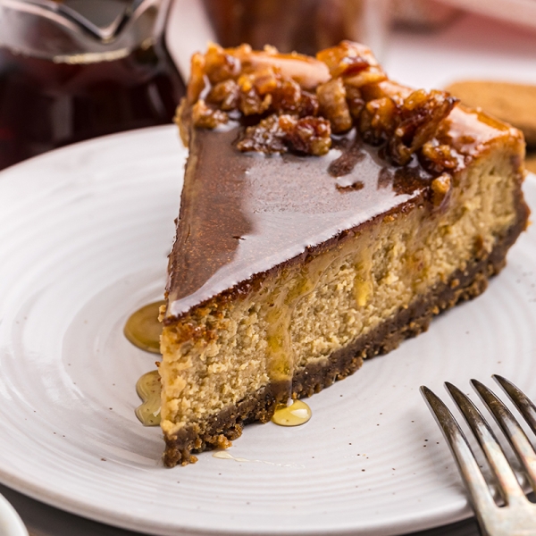 angled close up shot of slice of maple cheesecake on plate