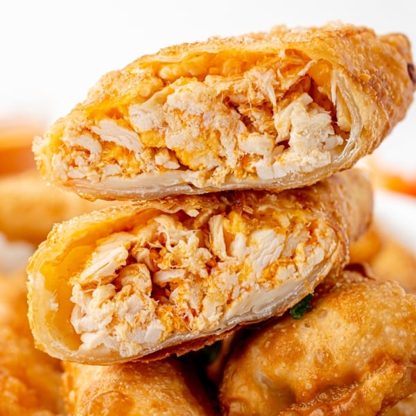 straight on shot of buffalo chicken egg roll cut in half