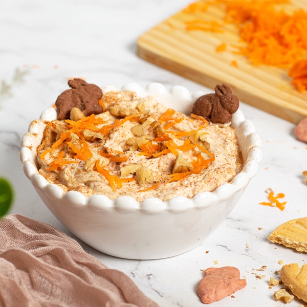 angled shot of carrot cake dip in a white bowl