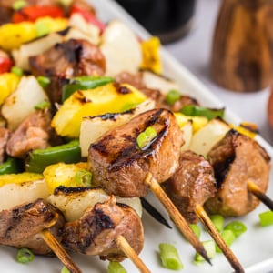 close up of teriyaki pork skewers