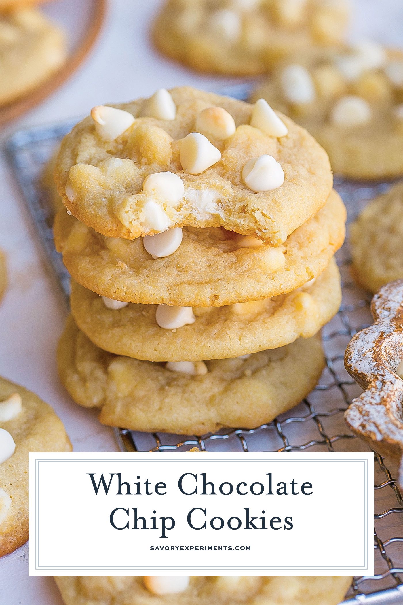 angled shot of stack of white chocolate chip cookies with text overlay