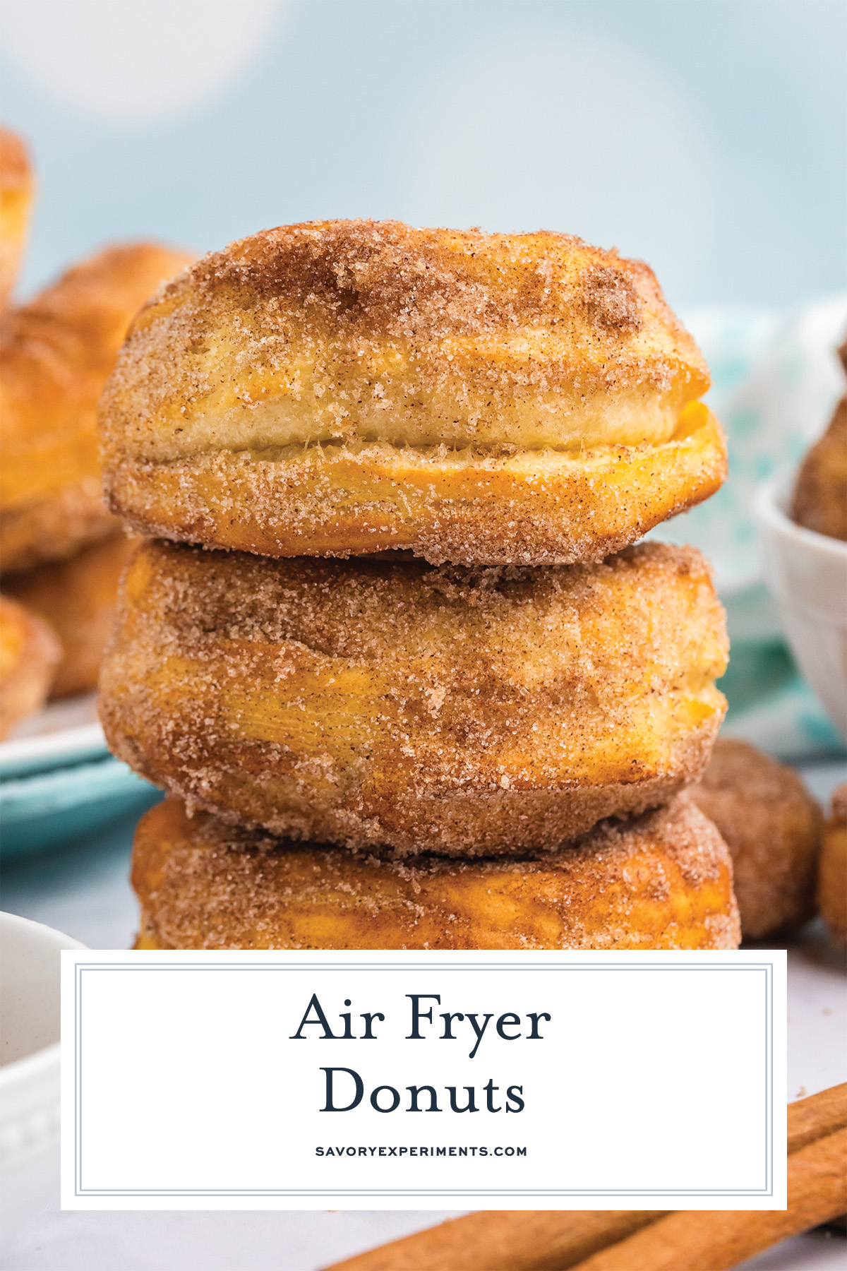 close up of air fryer donuts with cinnamon sugar topping