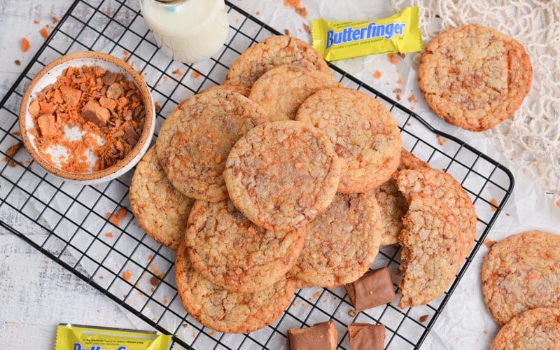 overhead shot of piled of butterfinger cookies on cooling rack