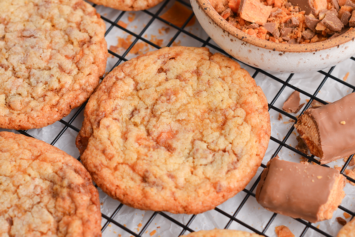 close up of baked butterfinger cookie on a cooling rack