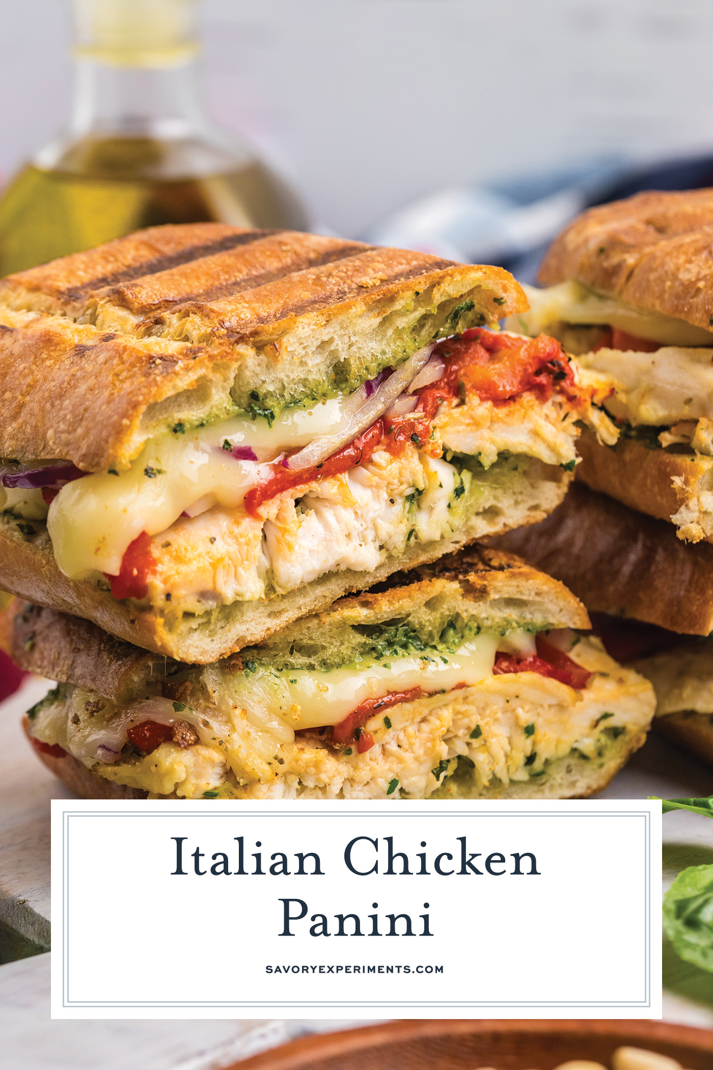 straight on shot of stack of italian chicken panini with text overlay