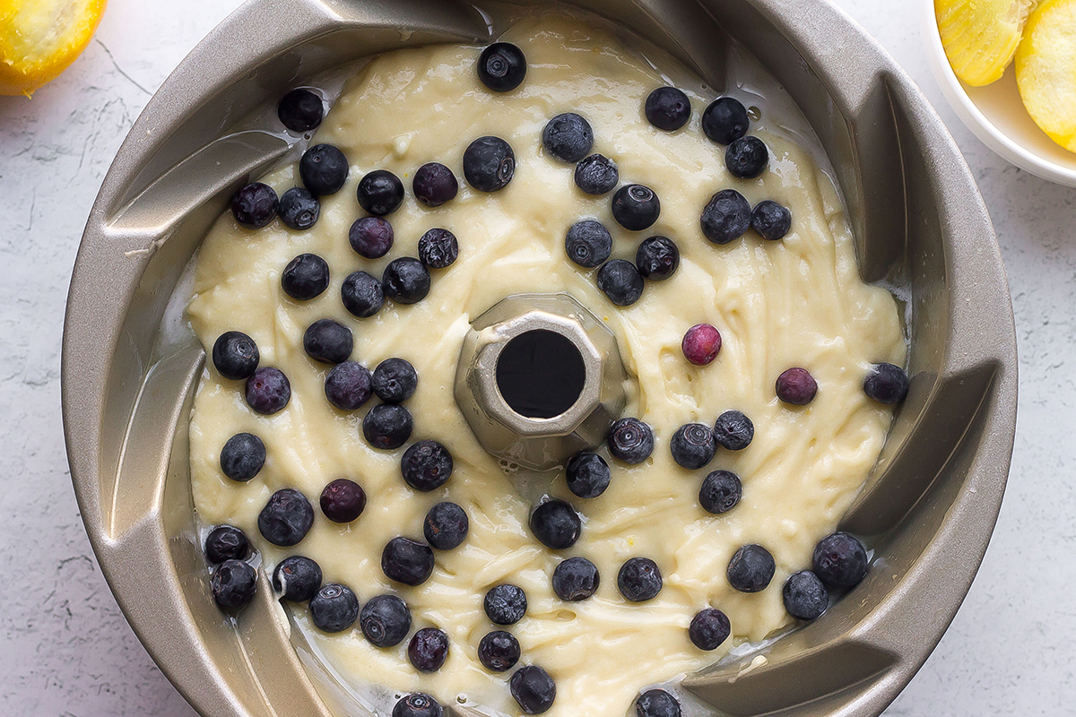overhead shot of lemon blueberry cake batter in bundt pan